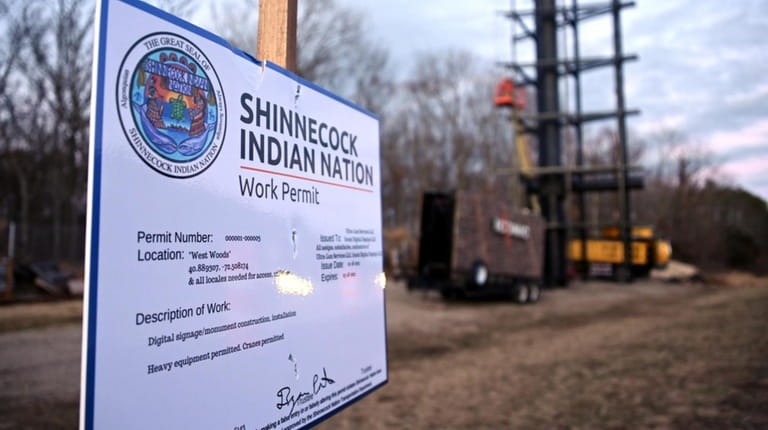 A work permit is displayed on the site where the Shinnecock...