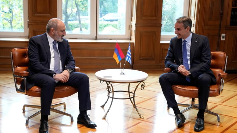 Greece's Prime Minister Kyriakos Mitsotakis, right, and his Armenian counterpart...