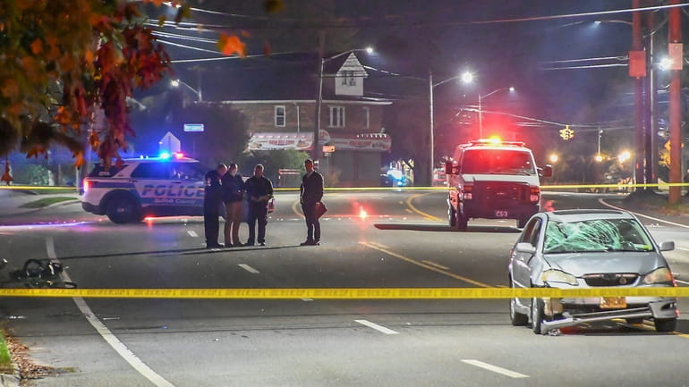 Suffolk County police on the scene in Copiague where a...