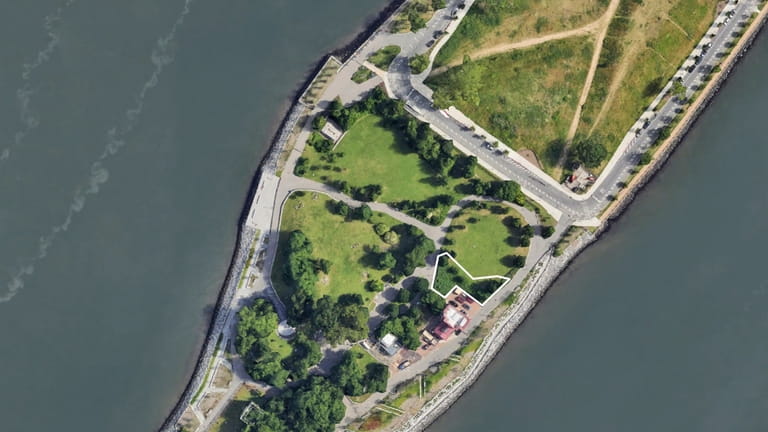 An overhead view of Roosevelt Island, where the Manhattan Healing...