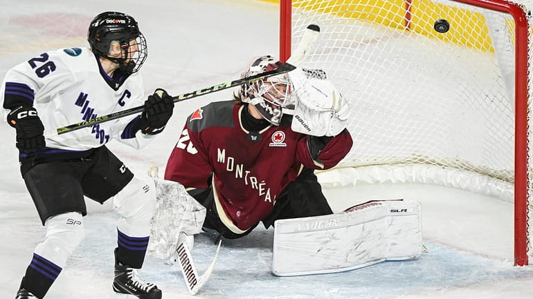 Minnesota's Kendall Coyne Schofield (26) scores against Montreal goaltender Elaine...