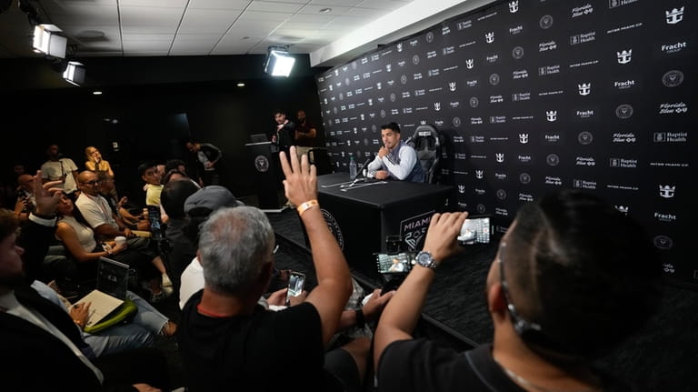 Inter Miami forward Luis Suarez takes questions during a press...