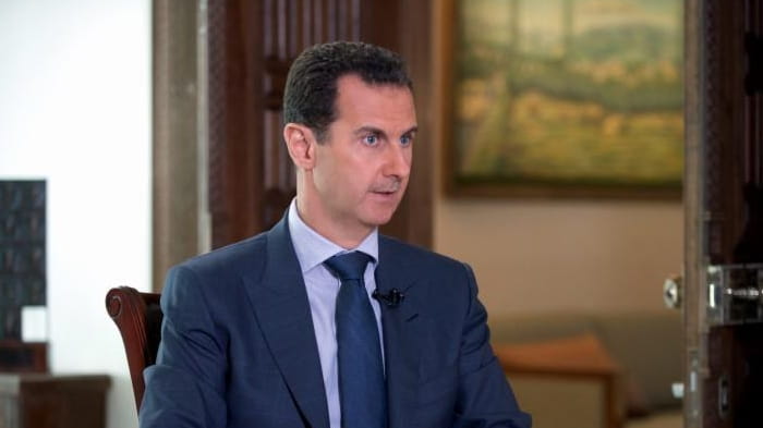 Syrian President Bashar Assad speaks to The Associated Press at...