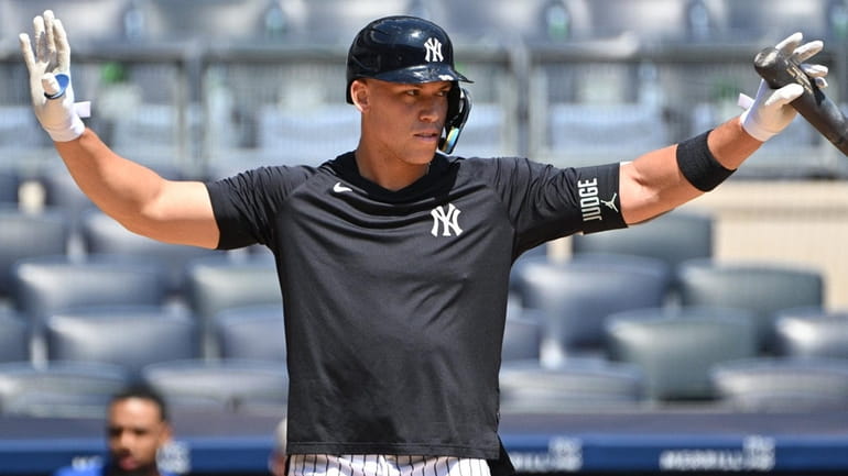 The Yankees' Aaron Judge gestures while taking batting practice with...