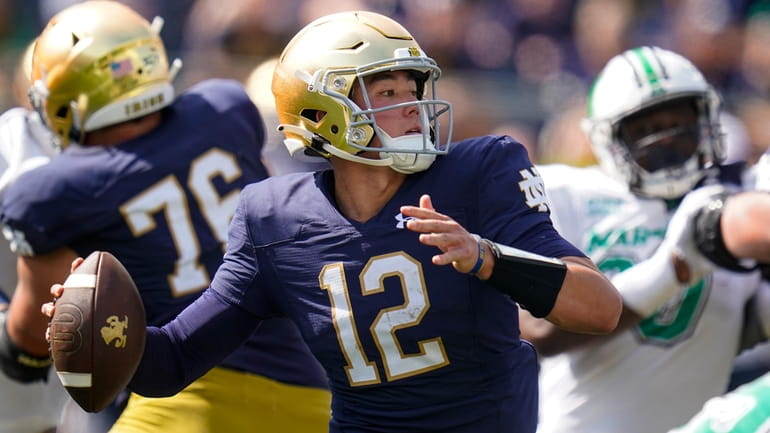Notre Dame quarterback Tyler Buchner throws against Marshall during the first...