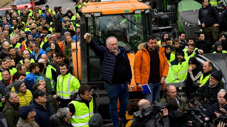 Farmers with their tractors attend a protest in Pamplona, northern...