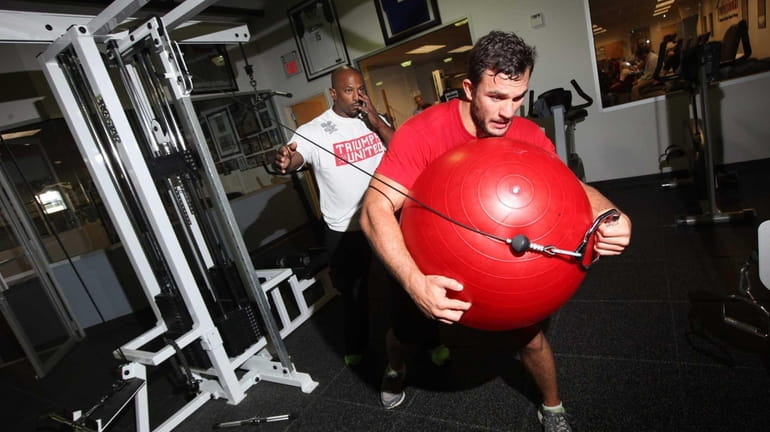 MMA fighter Gian Villante of Levittown exercises as his strength...