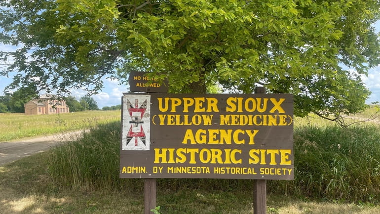 A large wooden sign that says "Upper Sioux (Yellow Medicine)...