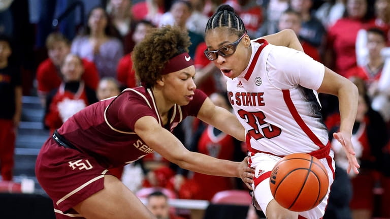 North Carolina State's Zoe Brooks (35) is fouled by Florida...