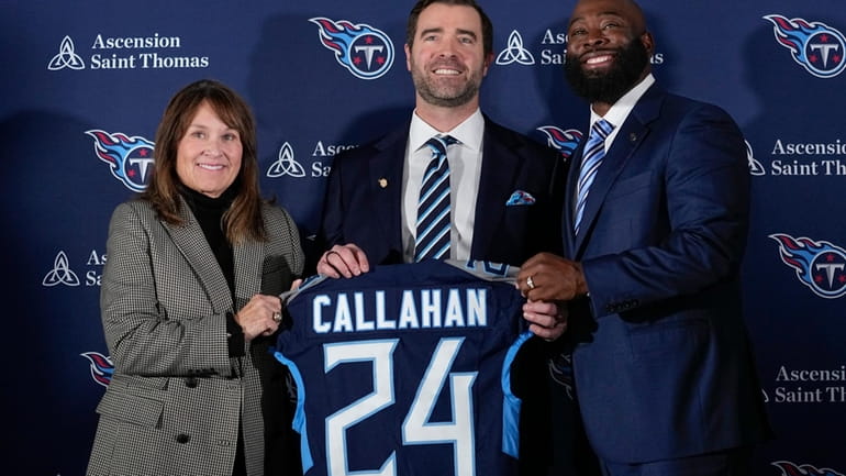 Tennessee Titans new head football coach Brian Callahan, center, poses...