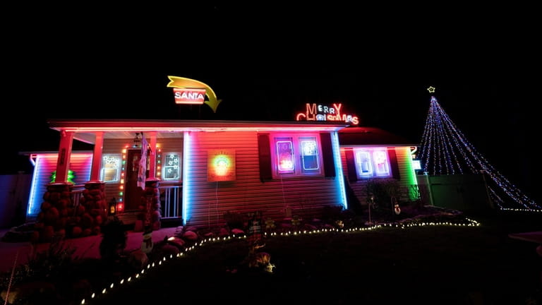Rocklein family's holiday decorations feature the warm glow of neon.