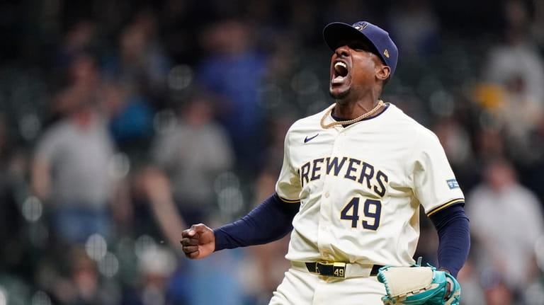 Milwaukee Brewers' Thyago Vieira reacts to the last out of...