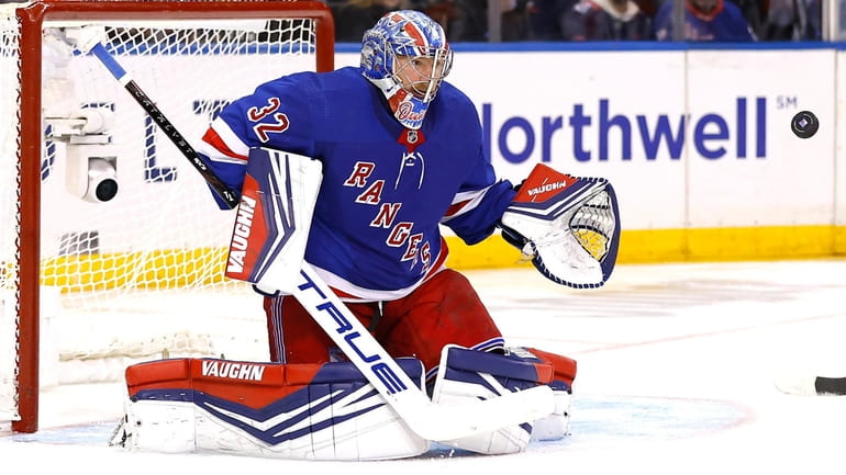 Rangers goaltender Jonathan Quick  makes a save against the Red...