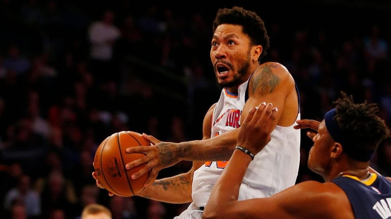 Derrick Rose of the New York Knicks goes to the...