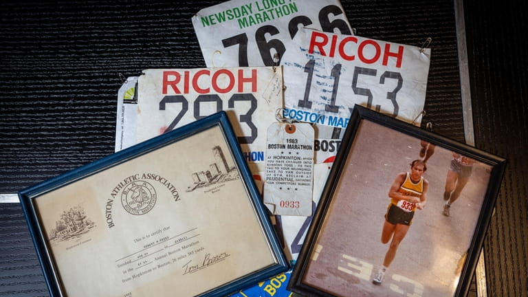 Memorabilia capturing Robert Fried's years of running races are seen...