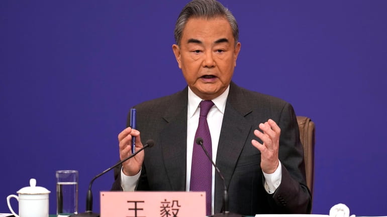 Chinese Foreign Minister Wang Yi speaks during a press conference...