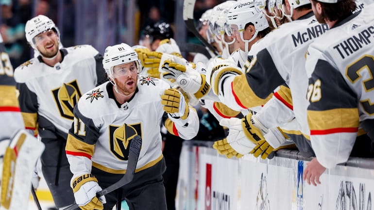 Vegas Golden Knights right wing Jonathan Marchessault is congratulated for...