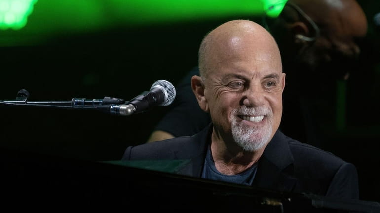 Billy Joel performs at the Formula One Grand Prix at...