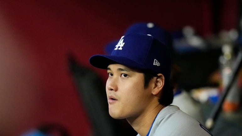 Los Angeles Dodgers' Shohei Ohtani, of Japan, watches the action...