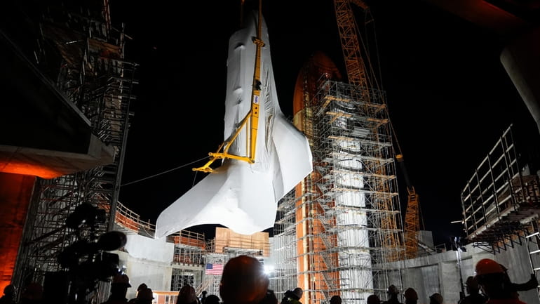 Space Shuttle Endeavour is lifted into the site of the...