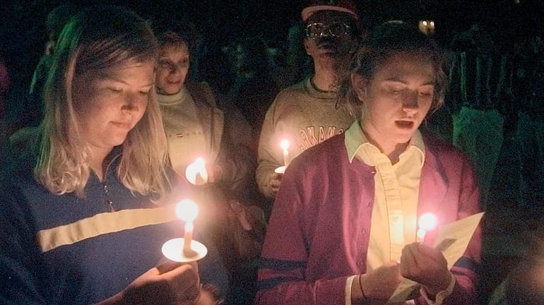 Students appear at a vigil against violence at Prexy's Pasture...