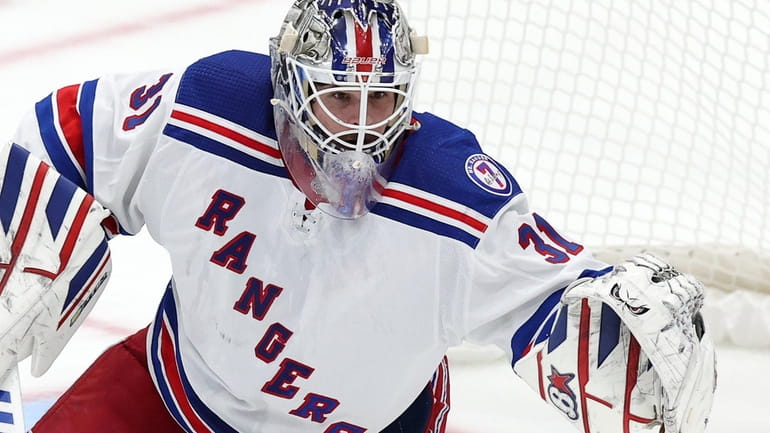 Igor Shesterkin #31 of the Rangers makes a save against...