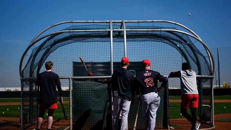 Cleveland Guardians manager Stephen Vogt (12) watches batting practice during...