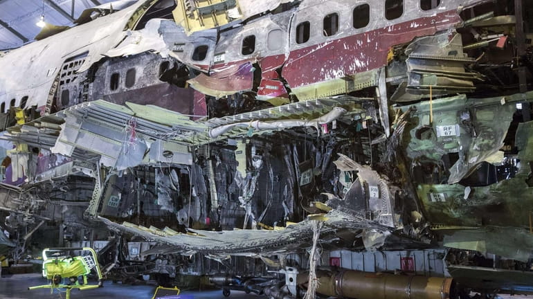 The partially reconstruced shell of the remains of TWA Flight...
