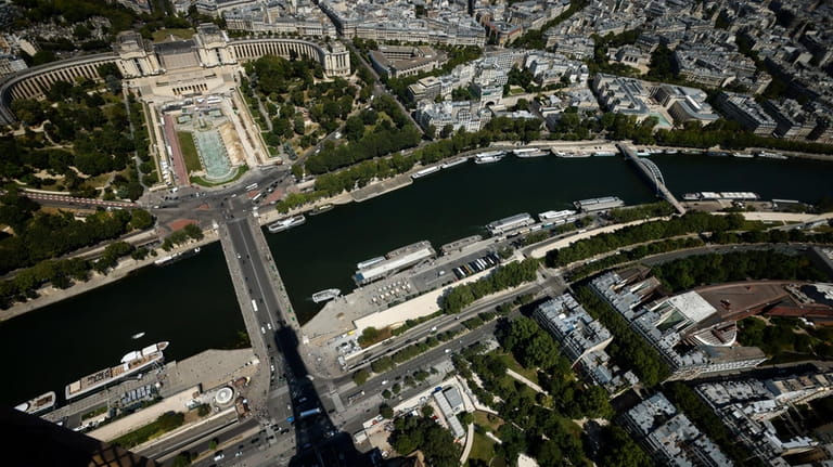The Eiffel Towers casts its shadow on the Iena bridge,...