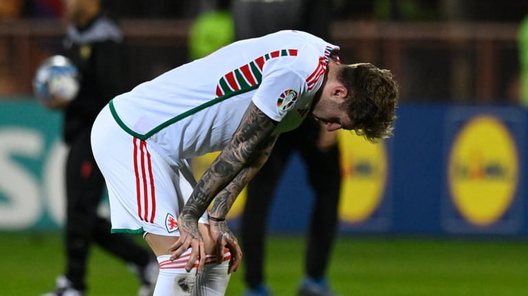Wales' Joe Rodon reacts after the Euro 2024 group D...