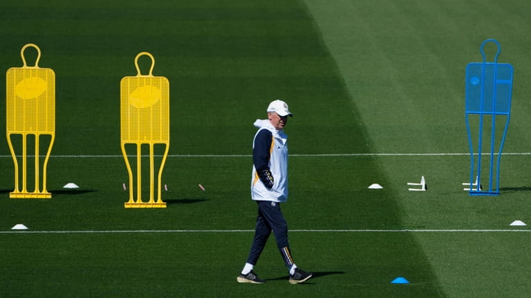 Real Madrid's head coach Carlo Ancelotti walks during a training...