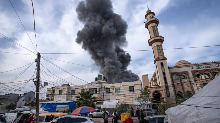 Smoke rises following an Israeli bombardment on Rafah, southern Gaza...