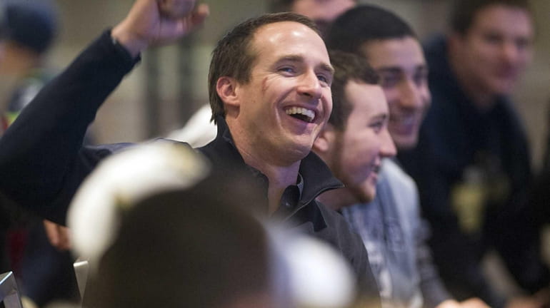 New Orleans Saints' quarterback Drew Brees playing Financial Football with...
