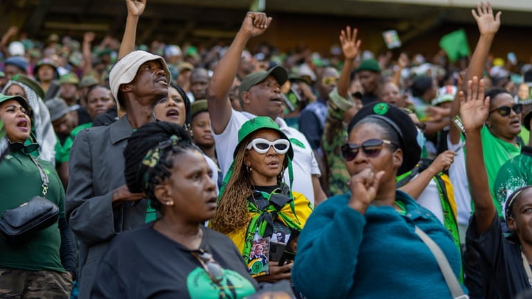 Supporters wait for former South African President Jacob Zuma to...