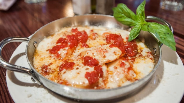 A baked ravioli dish at Butera's restaurant in Smithtown, which...