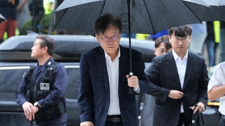 South Korea's main opposition Democratic Party leader Lee Jae-myung, center,...