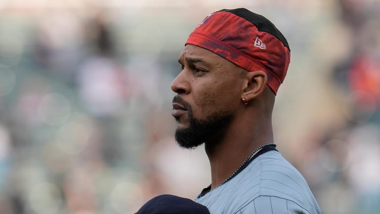 Minnesota Twins' Byron Buxton stands for The Star-Spangled Banner before...
