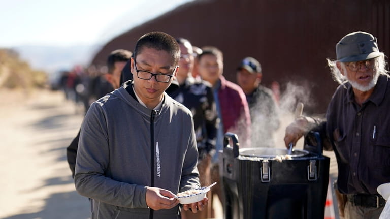 A man from China gets a bowl of oatmeal from...