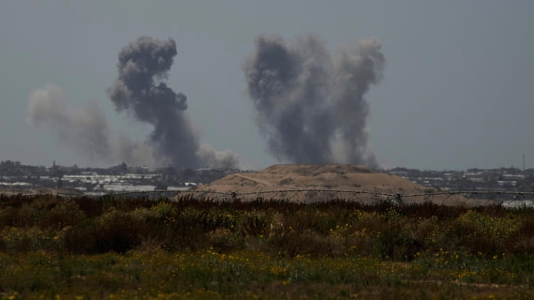 Smoke rises following an Israeli bombardment in the Gaza Strip...
