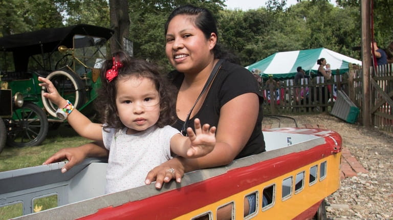 Vania Colasante, of Centerport, rides with her daughter, Alison Colasante,...