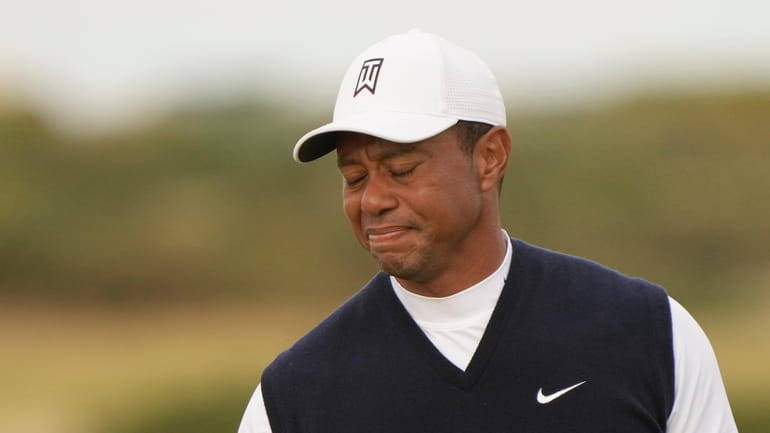 Tiger Woods of the US after putting on the 11th...