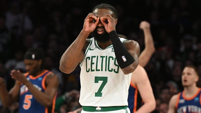 Boston Celtics guard Jaylen Brown gestures in the first half...