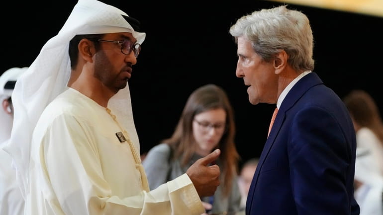 COP28 President Sultan al-Jaber, left, and John Kerry, U.S. Special...
