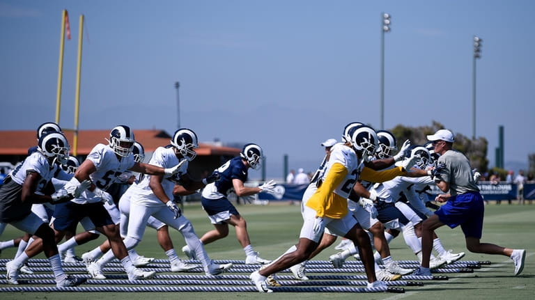 The Los Angeles Rams special teams participate in drills during...