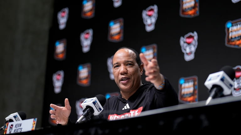 North Carolina State head coach Kevin Keatts speaks to the...