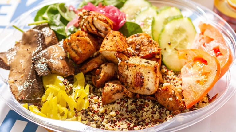 A build-your-own bowl with chicken souvlaki, quinoa and toppings from Super Greek...