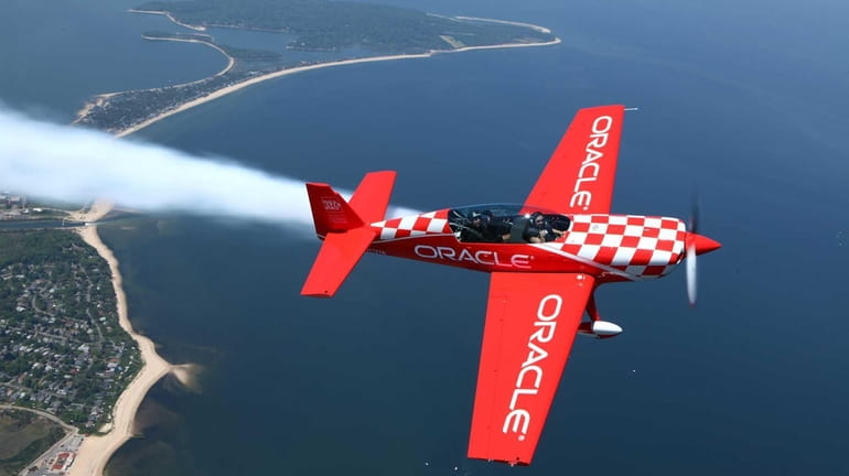 Team Oracle aerobatic pilot, Sean Tucker, left, takes Newsday's Meghan...
