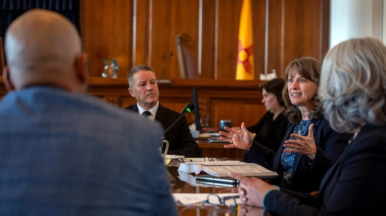 New Mexico Supreme Court Chief Justice Shannon Bacon, second right,...