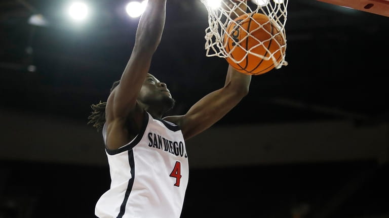San Diego State forward Jay Pal dunks against Fresno State...