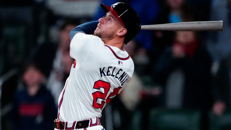 Atlanta Braves' Jarred Kelenic drives in a run with a...